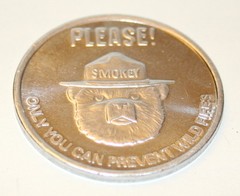 Vintage Smokey The Bear Aluminum Prevent Forest Fire Token NOS